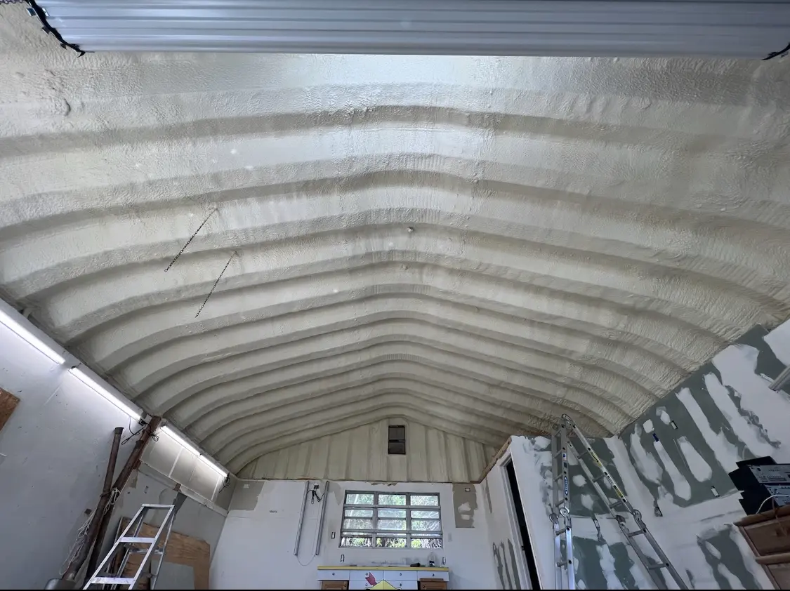 Spray polyurethane foam applied to the underside of a metal roof deck in Pasadena